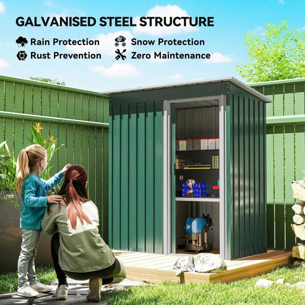 Green metal garden storage shed with sloped roof and open sliding door with storage shelves