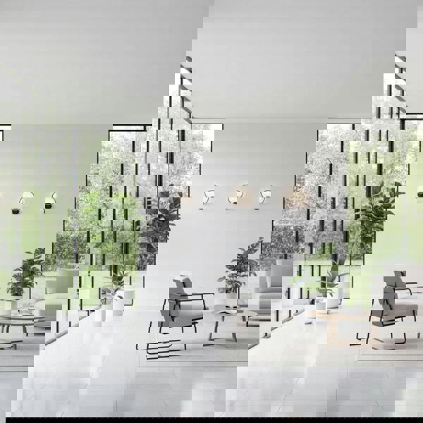 Black LED indoor wall lamp on the wall of a modern conservatory