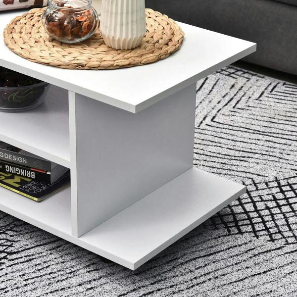 White TV cabinet stand corner with open shelf compartments and smooth square tabletop