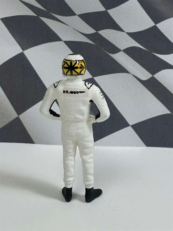 a toy figure of a man wearing a helmet