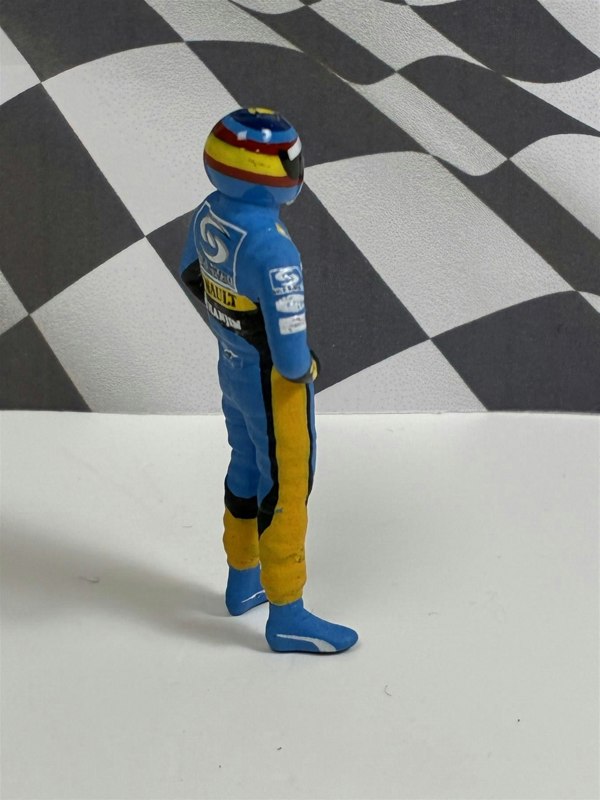 a toy figure in a race car suit