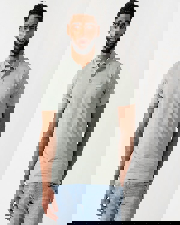 Model wearing a BOSS Orange Passenger Mens Stretch-Cotton Slim-Fit Polo Shirt with Logo Patch in Open Green