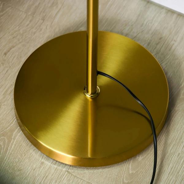 Gold circular base with power cord and center pole for three-light globe floor lamp