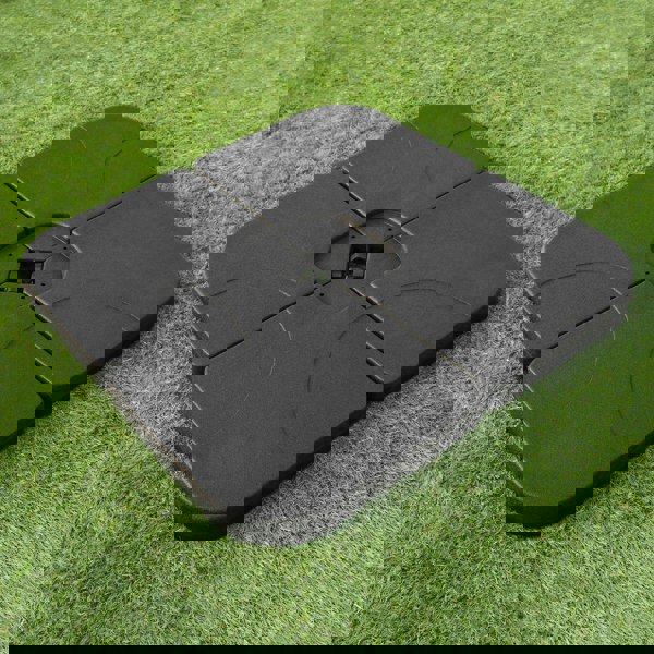 Black square base for cantilever parasol, made of durable material, featuring a textured surface and designed for stability on grass