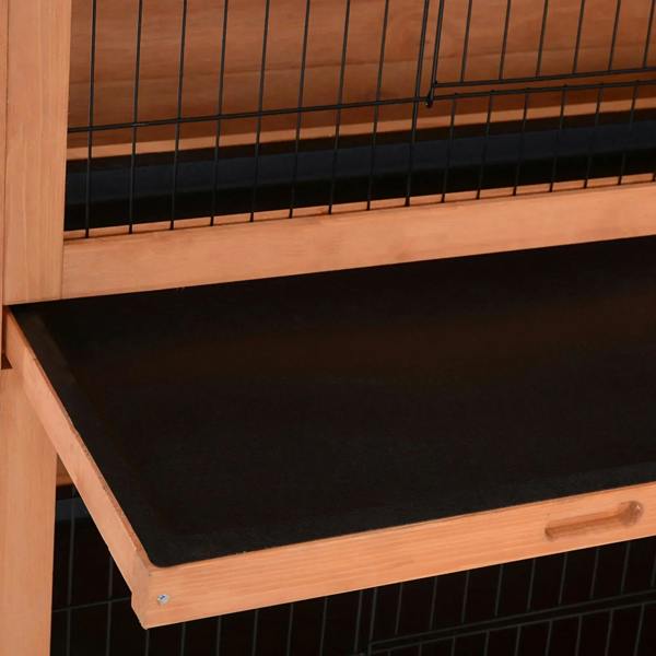 Orange wooden rabbit hutch front close-up with black tray base and wire mesh bars