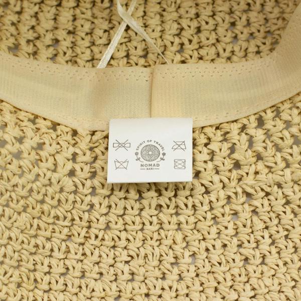 Natural beige straw hat inside label on stitched ribbon trim