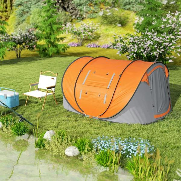 Orange and dark gray pop-up camping tent standing on outdoor grass with dual ends