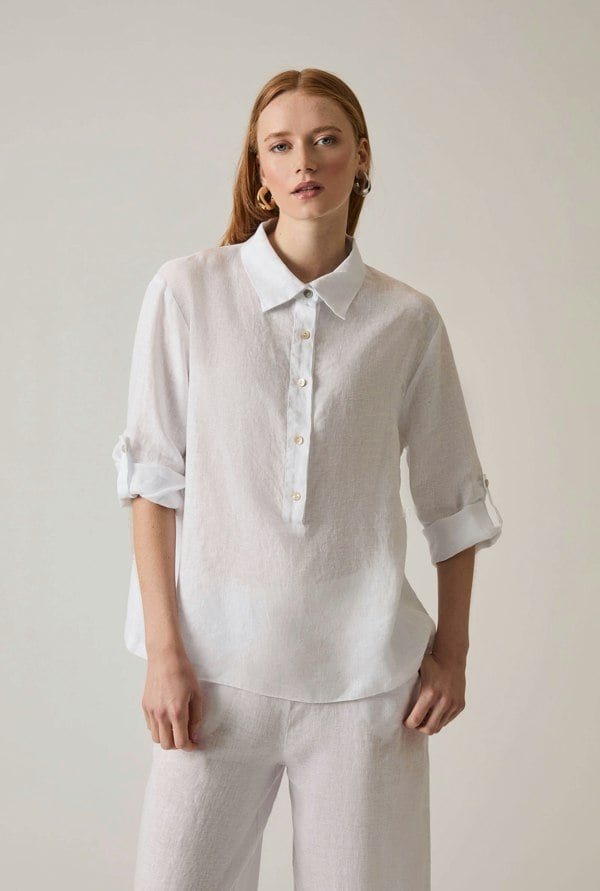 White linen blouse with button front and roll tabs