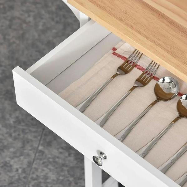 White pull-out drawer on a kitchen trolley with cutlery neatly arranged inside