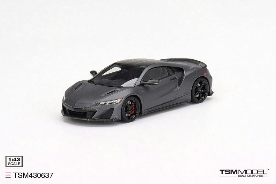 a grey sports car on a white background