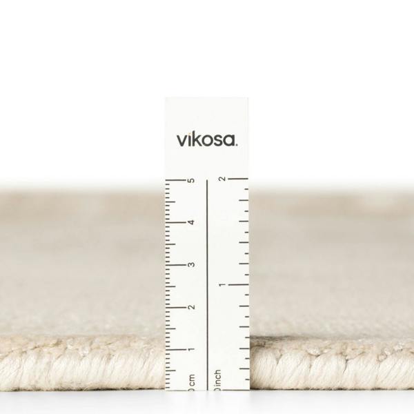 Beige fabric swatch with a ruler and 'vikosa' branding