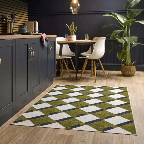 Modern kitchen with a geometric patterned rug on wooden flooring