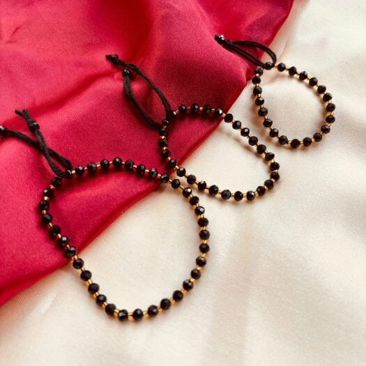 The Colourful Aura Adjustable Gold Black Beads Bracelet For Newborns and Adults