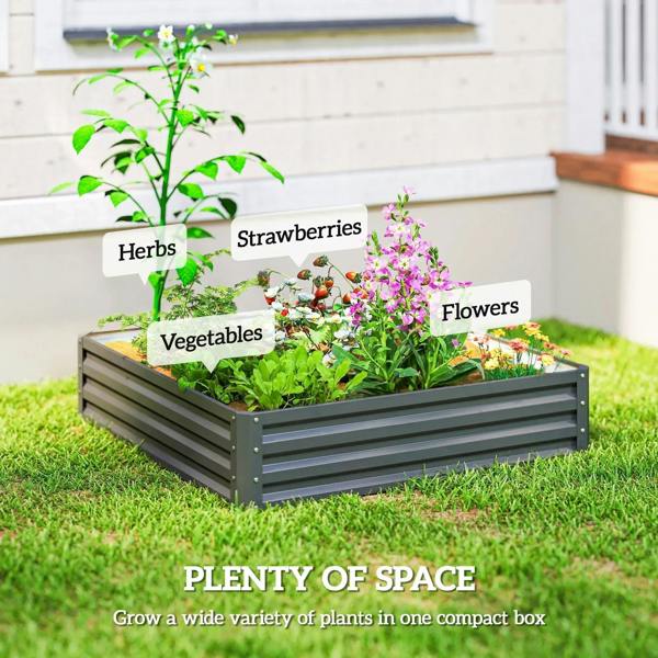 Light grey raised garden bed with slatted steel sides on grass, ready for planting