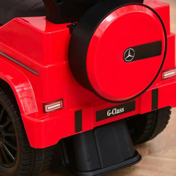 Red side view kids ride-on push car with G-Class badge, handle and rear wheels