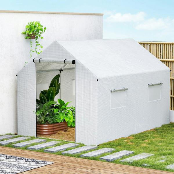 White walk-in polytunnel greenhouse with open entrance and side mesh windows
