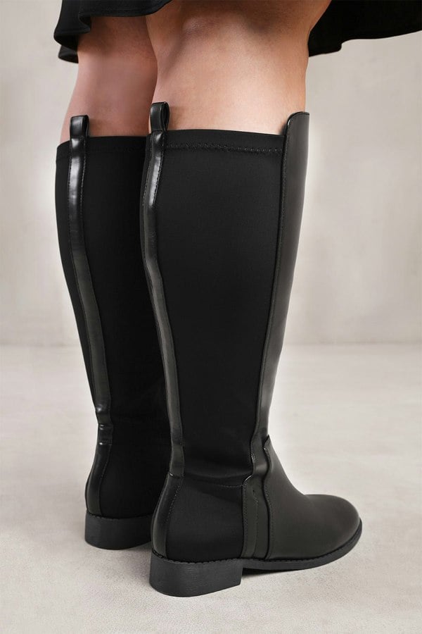 Where's That From PParker Stretch Wide Calf Knee High Boots With Side Zip In Wide E Fit In Black Faux Leather