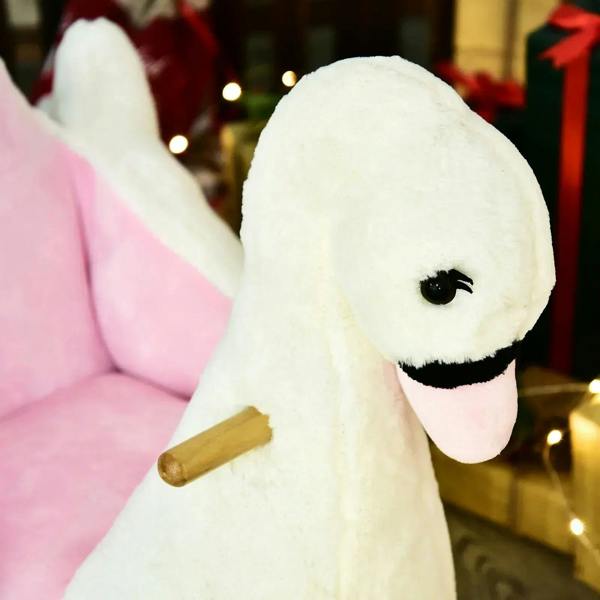 White plush swan head with black eye and beige wooden handle detail