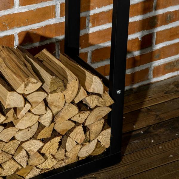 Black metal firewood rack corner with stacked logs and vertical support posts.