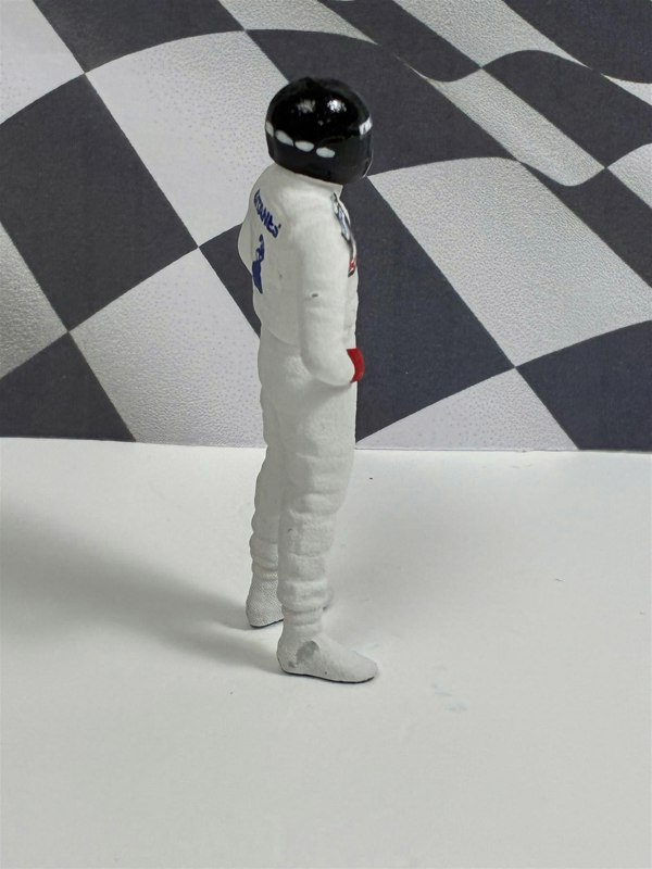 a toy figure in a white uniform