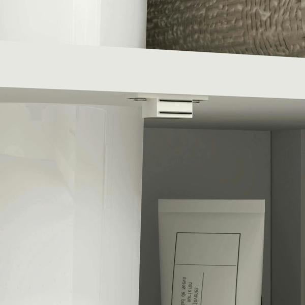White under-sink cabinet interior with shelf beneath an open door area