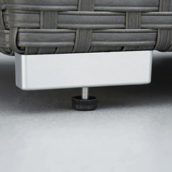 Close-up of adjustable leveling feet under a grey rattan ottoman