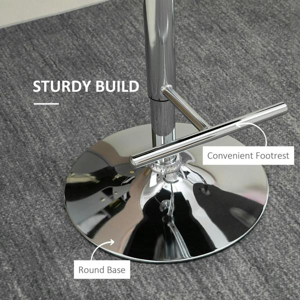 Chrome round base and footrest of a swivel grey velvet bar stool