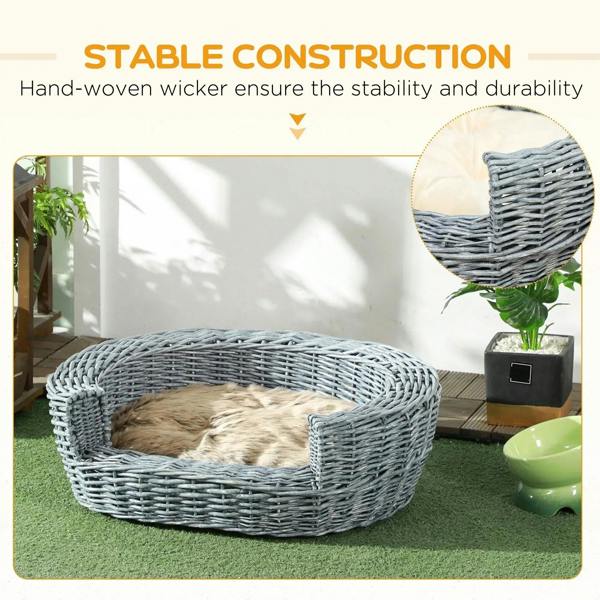 Grey wicker oval pet bed with beige cushion, outdoor patio styling