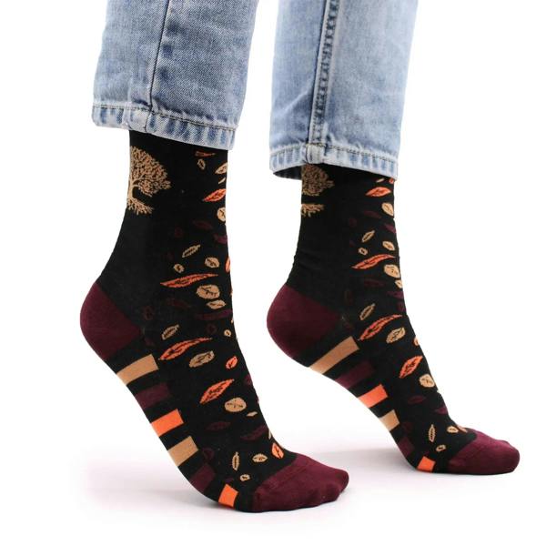 Black bamboo socks full-foot view with tree-and-leaf print; burgundy toe/heel and stripes