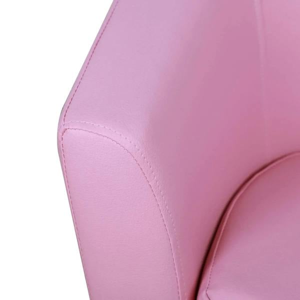 Pink armchair armrest close-up with stitched upholstery and padded edge