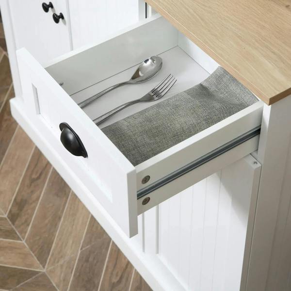 White kitchen cabinet drawer open with utensils and silverware tray inside