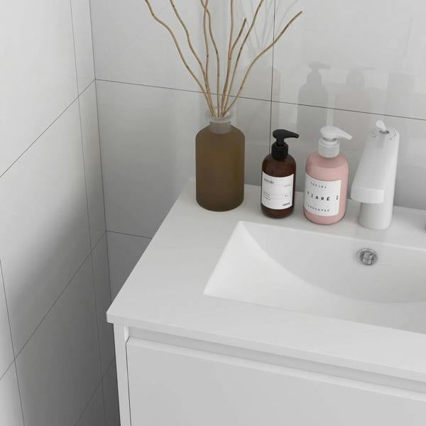 Corner view of high gloss white bathroom vanity with rectangular sink basin and tap hole