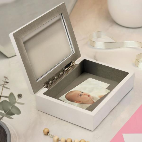 Open wooden jewellery box with internal mirror and storage compartment.