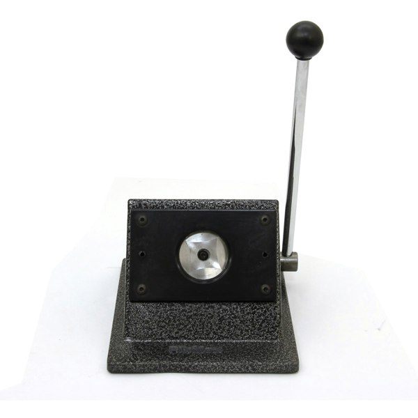 Heavy-duty badge maker with a textured black base, silver lever, and circular cutting area for precise badge creation