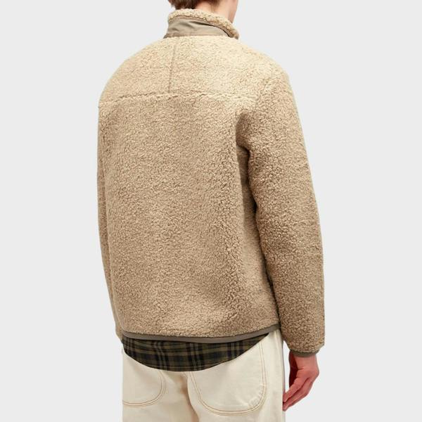 Back view of a Supplied Fashion beige heather fleece zip jacket with textured fabric and a plaid shirt hem