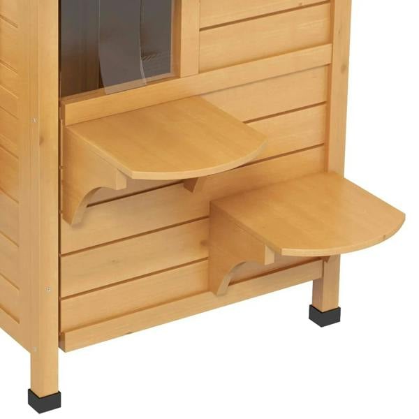 Outdoor wooden cat house close-up of side steps, corner perch, and arched lower entrance