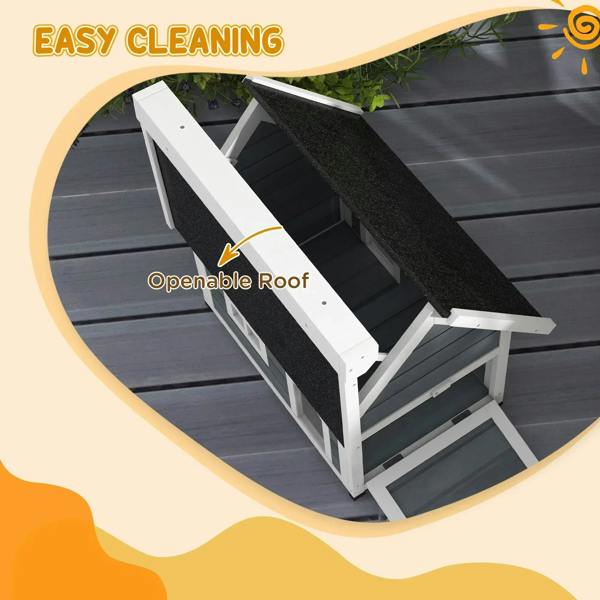 Grey wooden cat house with openable dark asphalt roof and arched front door