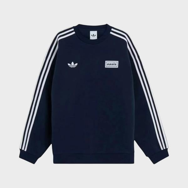 Supplied Fashion navy blue oversized crewneck sweatshirt with white adidas three-stripe sleeves and Oasis tour logo.
