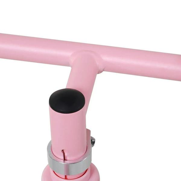 Pink balance bike handlebar stem with black pivot cap