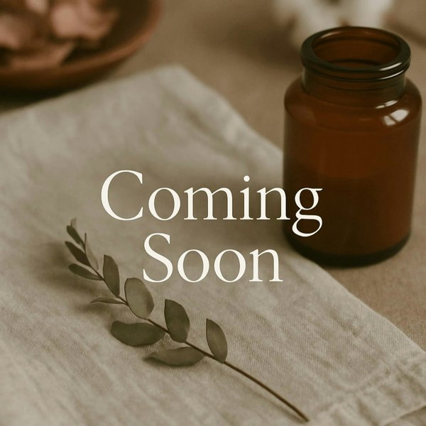 Brown bottle on a textured surface with 'Coming Soon' text overlay