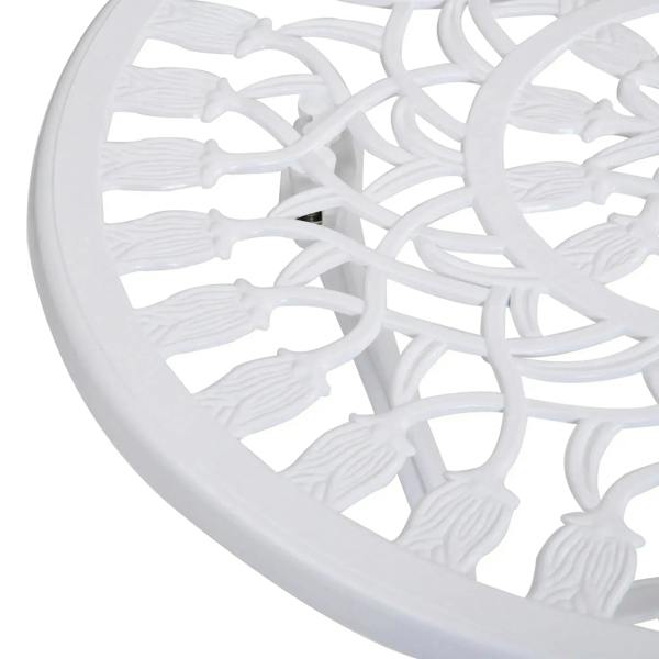 White ornate chair back and seat with decorative cutout pattern