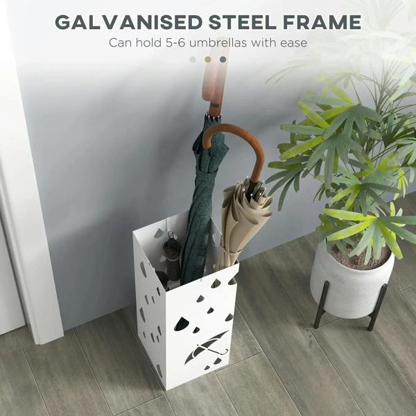 White umbrella stand with raindrop cutouts, holding umbrellas near entry