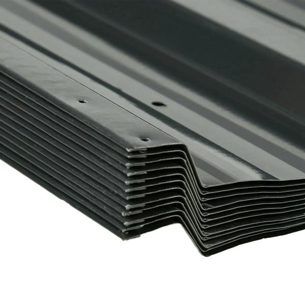 Stacked dark grey corrugated steel roof panels with interlocking edge and screw holes