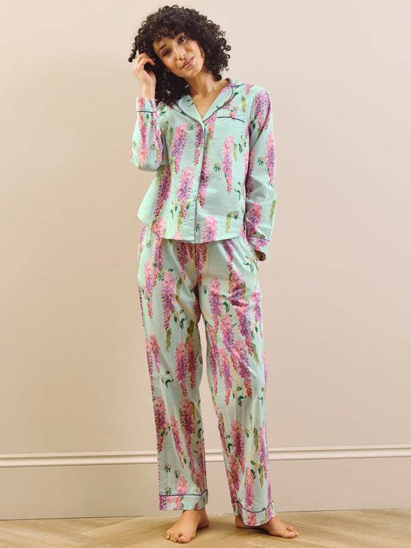 model wears wisteria print short pyjama set. 