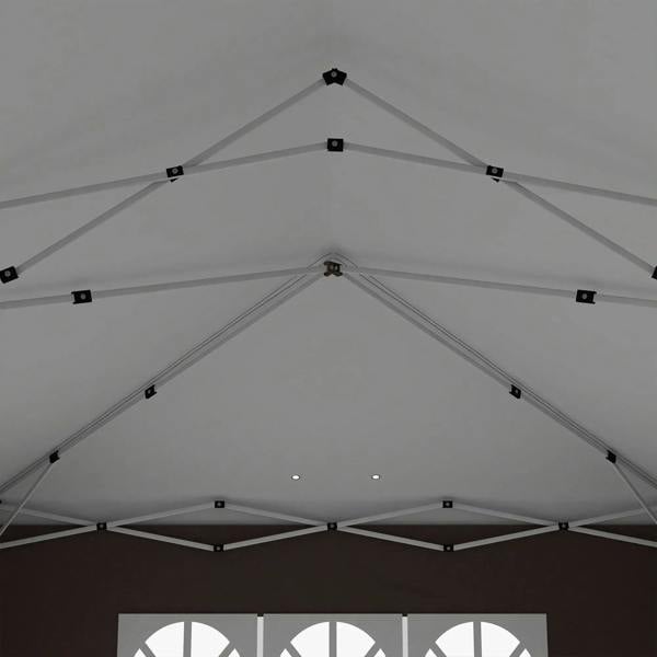 Underside of pop-up gazebo roof with white frame beams and tension points