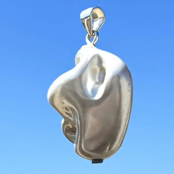 Silver shell pendant by LENAE London.