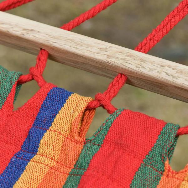 Close-up of red hanging rope tied to rainbow-striped hammock fabric