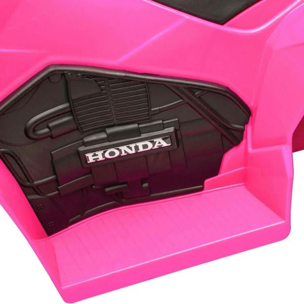Pink kids Honda electric quad bike under-seat storage compartment close-up