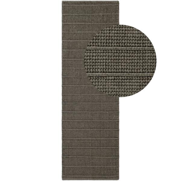 Brown textured bath mat with round rug inset on a white background