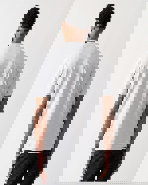 back shot of a model wearing a BOSS Orange TChup Mens Crew Neck Small Logo T-Shirt in Light-Pastel Grey